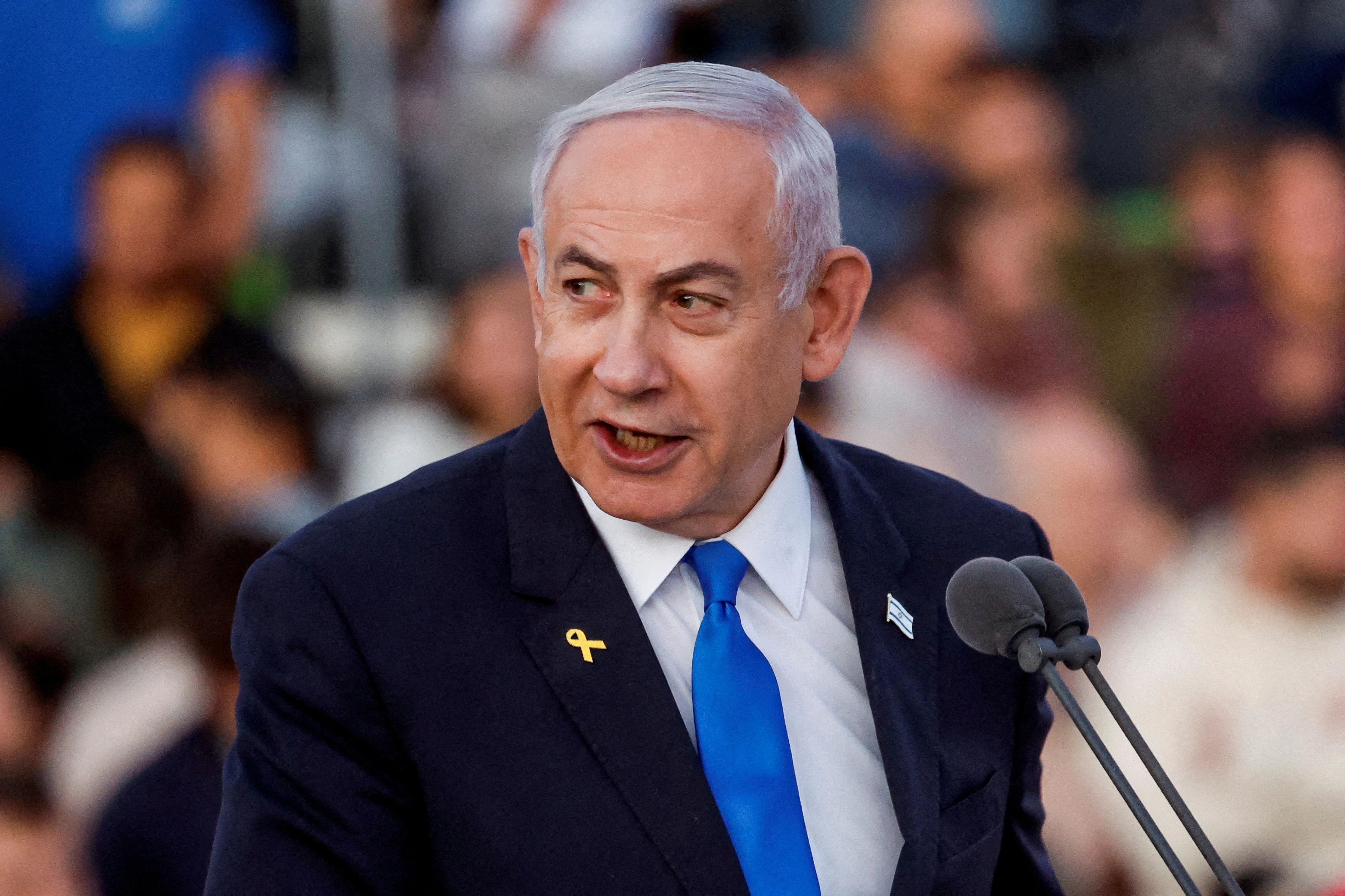 Israeli Prime Minister Benjamin Netanyahu speaks at a ceremony for military combat officers at an army base near Mitzpe Ramon, Israel, October 31, 2024. REUTERS/Amir Cohen/File Photo