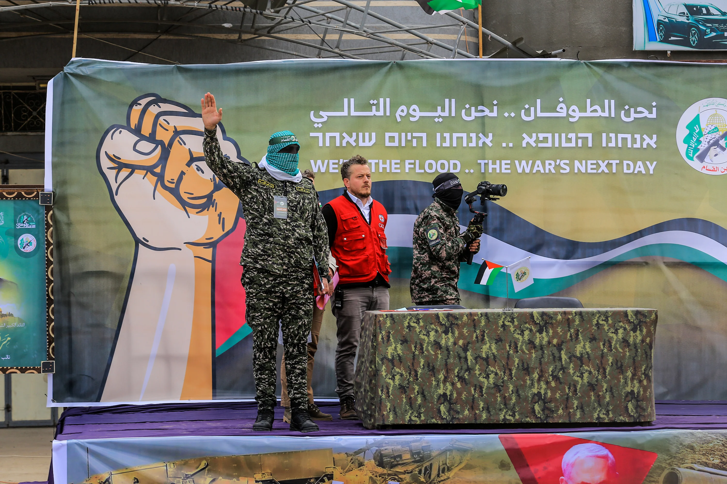 Hamas terrorists and a representative of the International Committee of the Red Cross during the hostage release ceremony, February 8, 2025. Photo: Reuters