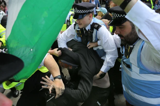 British Police arrest a protester during a pro-Palestine Action rally in London, June 23, 2025. (Credit: Martin Pope/ZUMA Press Wire)