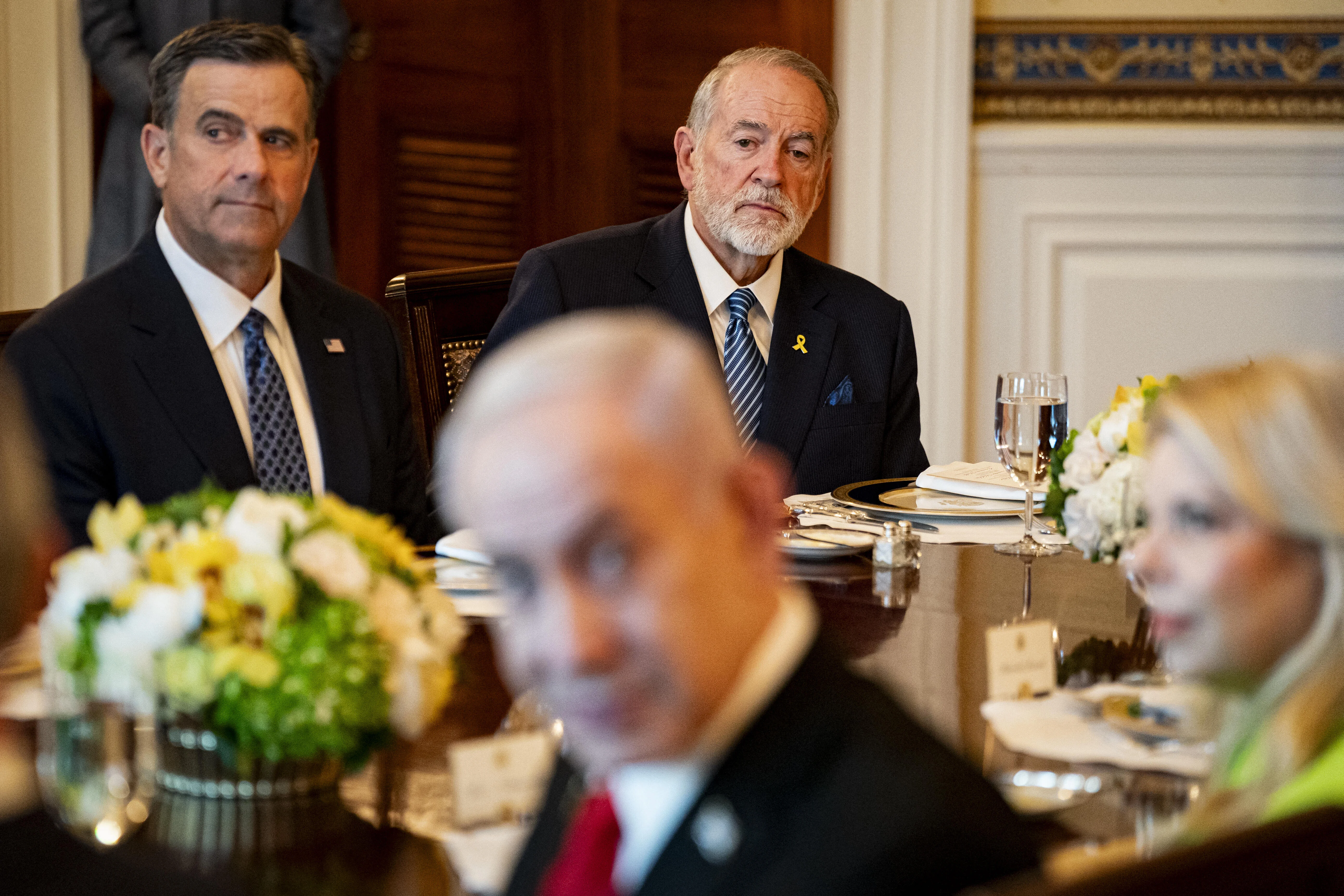 John Ratcliffe, director of the Central Intelligence Agency (CIA), left, and Mike Huckabee, US ambassador to Israel, top right, with Israeli Prime Minister Benjamin Netanyahu, during a dinner with US President Donald Trump, not pictured, in the Blue Room of the White House in Washington, DC, US, on Monday, July 7, 2025. Israeli Prime Minister Benjamin Netanyahu told President Donald Trump he nominated him for the Nobel Peace Prize, using a visit to the White House to further cement the pair’s relationship as the US presses for a ceasefire in Gaza. Photo by Al Drago/Pool/ABACAPRESS.COM