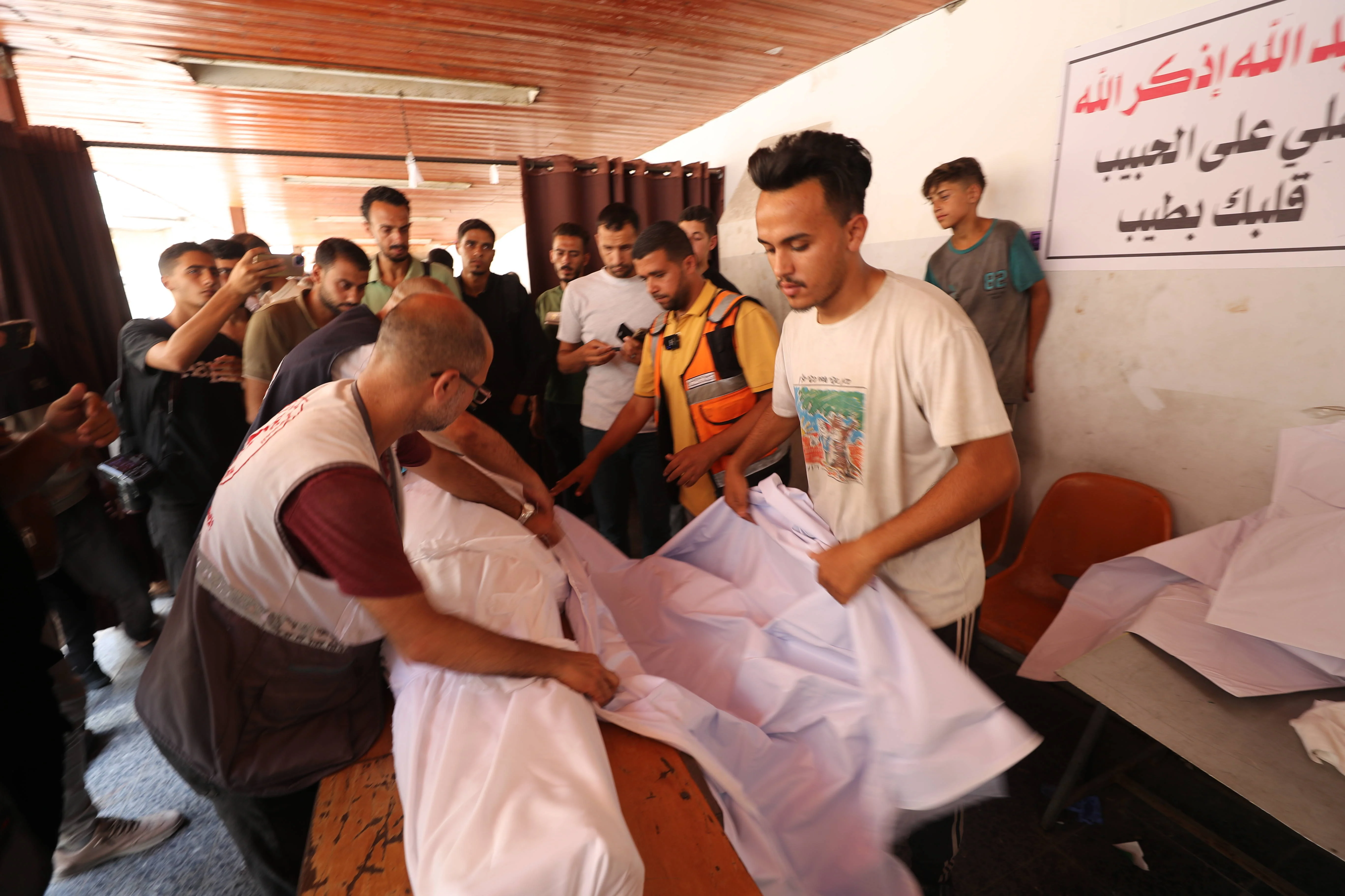 Christian mourners gather at Gaza City’s Al‑Ahli (Baptist) Hospital to collect a loved one’s body following an Israeli strike on the Holy Family Church, Gaza City, July 17, 2025. (Photo: via Reuters)