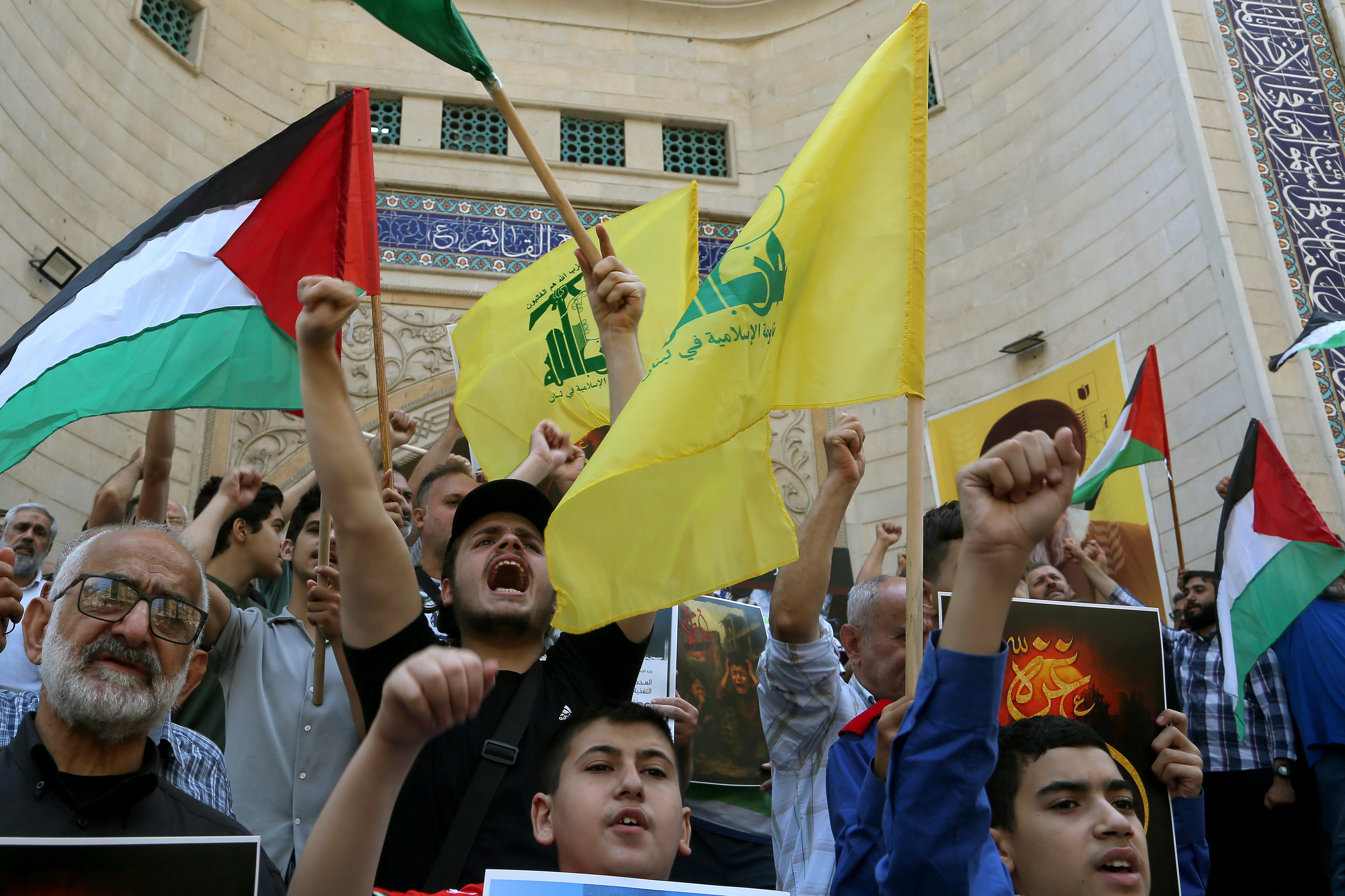 August 1, 2025, Beirut, Beirut, Lebanon: Pro-Iranian Hezbollah supporters raise their fists and chant slogans during a protest in Beirut southern suburb, a hot bed for Hezbollah, in support of Palestinians in Gaza strip suffering from lack of food, water and medicine. Photo: Reuters by Marwan Naamani