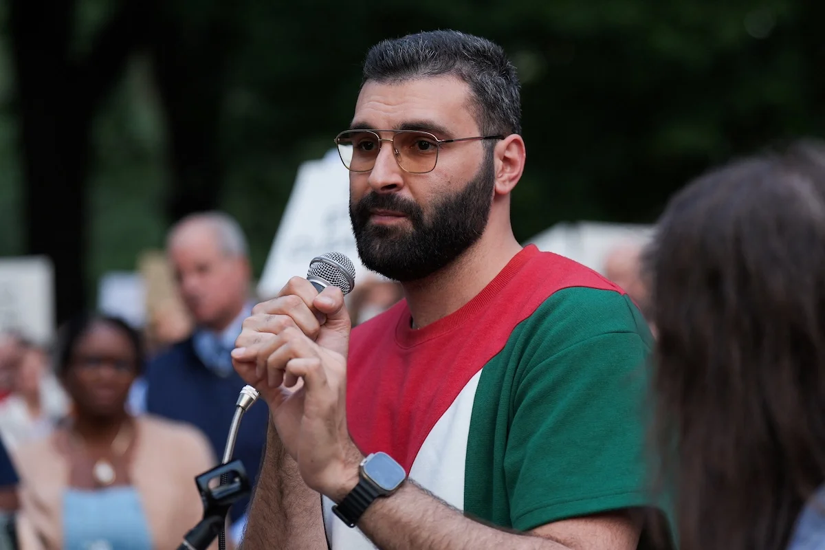 Palestinian photojournalist Motaz Azaiza speaks during a rally against the hunger crisis in Gaza