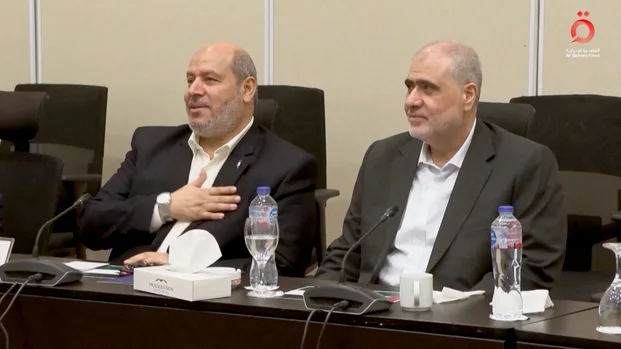 Senior Hamas official Khalil Al-Hayya gestures as he attends a meeting with Egyptian, Qatari and Turkish delegations ahead of a Gaza ceasefire deal announcement, in Sharm El-Sheikh, Egypt, October 8, 2025, in this still image obtained from a video. Al-Qahera News/Handout via REUTERS