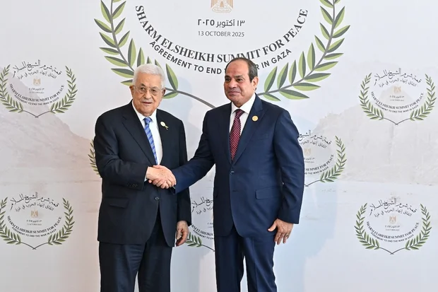 Palestinian Authority President Mahmoud Abbas and Egyptian President Abdel Fattah el-Sisi attend the world leaders' summit on ending the Gaza war, amid a U.S.-brokered prisoner-hostage swap and ceasefire deal between Israel and Hamas, in Sharm el-Sheikh, Egypt, October 13, 2025. (Photo: Egyptian Presidency/Handout via REUTERS)