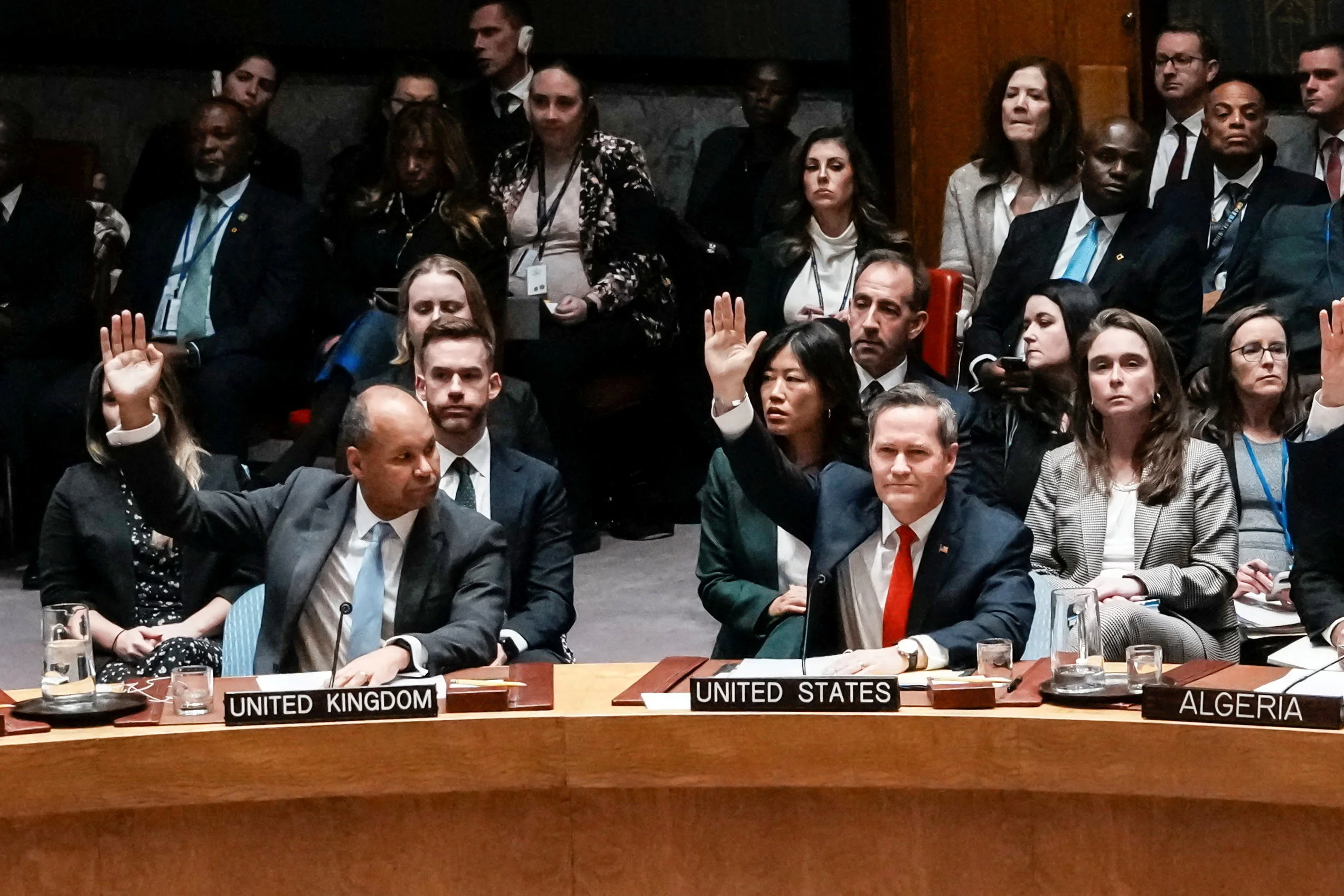 U.S Ambassador to United Nations Michael Waltz and Britain's Deputy Ambassador to the United Nations James Kariuki vote in favor for a resolution during a meeting of the United Nations Security Council to consider a U.S. proposal for a U.N. mandate to establish an international stabilization force in Gaza, at U.N. headquarters in New York City, U.S., November 17, 2025. Photo: Reuters Connect by Eduardo Munoz