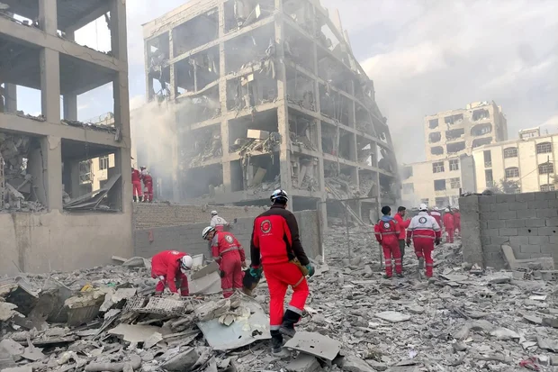 Rescue teams from the Iranian Red Crescent Society (IRCS) are working at the site of a building damaged by an airstrike in Resalat Square, Tehran, March 10, 2026. (Photo: Ircs via ZUMA Press Wire)