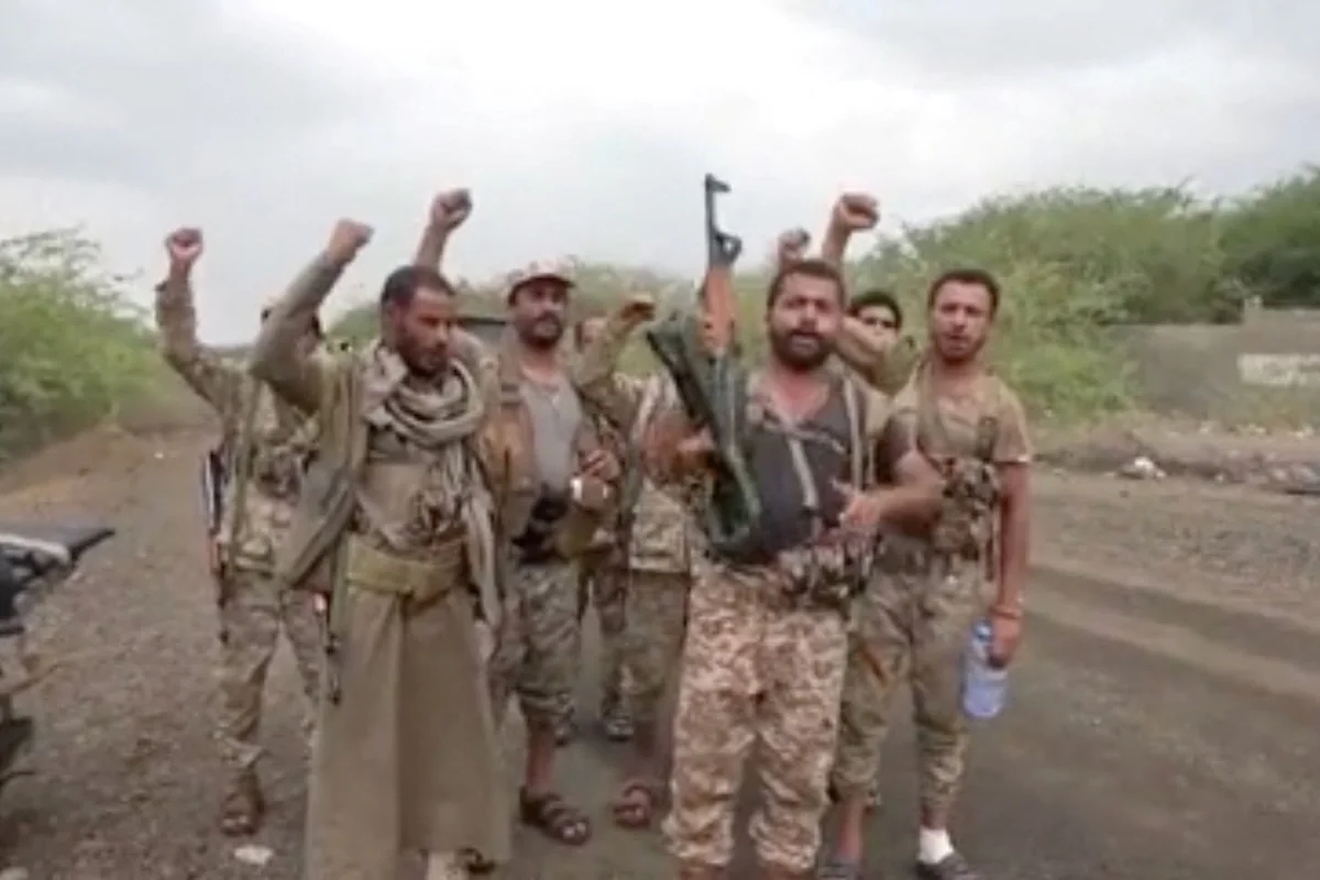 Men gesture in a screen grab from a video released September 11, 2026 and said to show Khaled bin Walid camp after Houthis