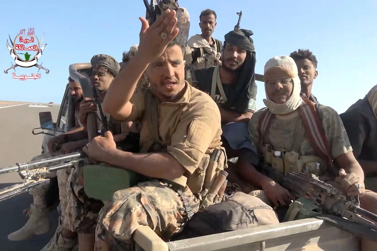 Pro-Saudi-backed Yemeni government fighters sit in the back of a vehicle during what government forces say was an advance against the Iran-backed Houthis, near Dhubab, Taiz Governorate