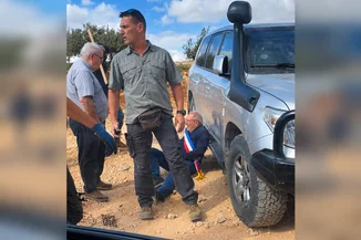 A man reacts on the ground where Belgium's foreign minister says Israeli settlers attacked Palestinians, Catholic representatives and Western diplomats and officials, in Taybeh, October 17, 2026. (Photo: Screenshot from a video obtained from social media. Amit Orfali/via REUTERS)