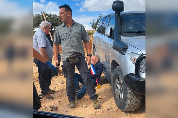 A man reacts on the ground where Belgium's foreign minister says Israeli settlers attacked Palestinians, Catholic representatives and Western diplomats and officials, in Taybeh, October 17, 2026. (Photo: Screenshot from a video obtained from social media. Amit Orfali/via REUTERS)