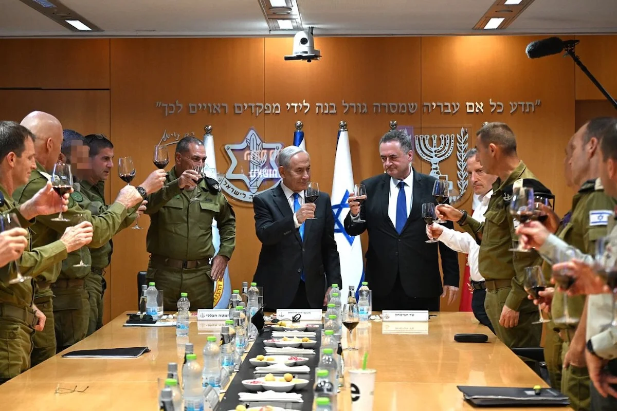 Israeli Prime Minister Benjamin Netanyahu holds a Rosh Hashanah toast at Defense Headquarters