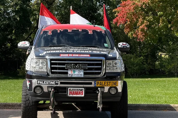 Customized GMC pickup truck covered in Palestinian flags, anti-Israel slogans in Dearborn, Michigan (Photo: David Brody)