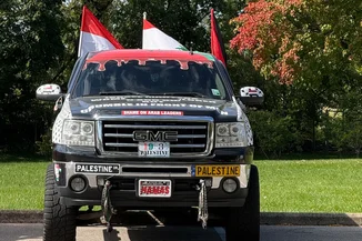Customized GMC pickup truck covered in Palestinian flags, anti-Israel slogans in Dearborn, Michigan (Photo: David Brody)