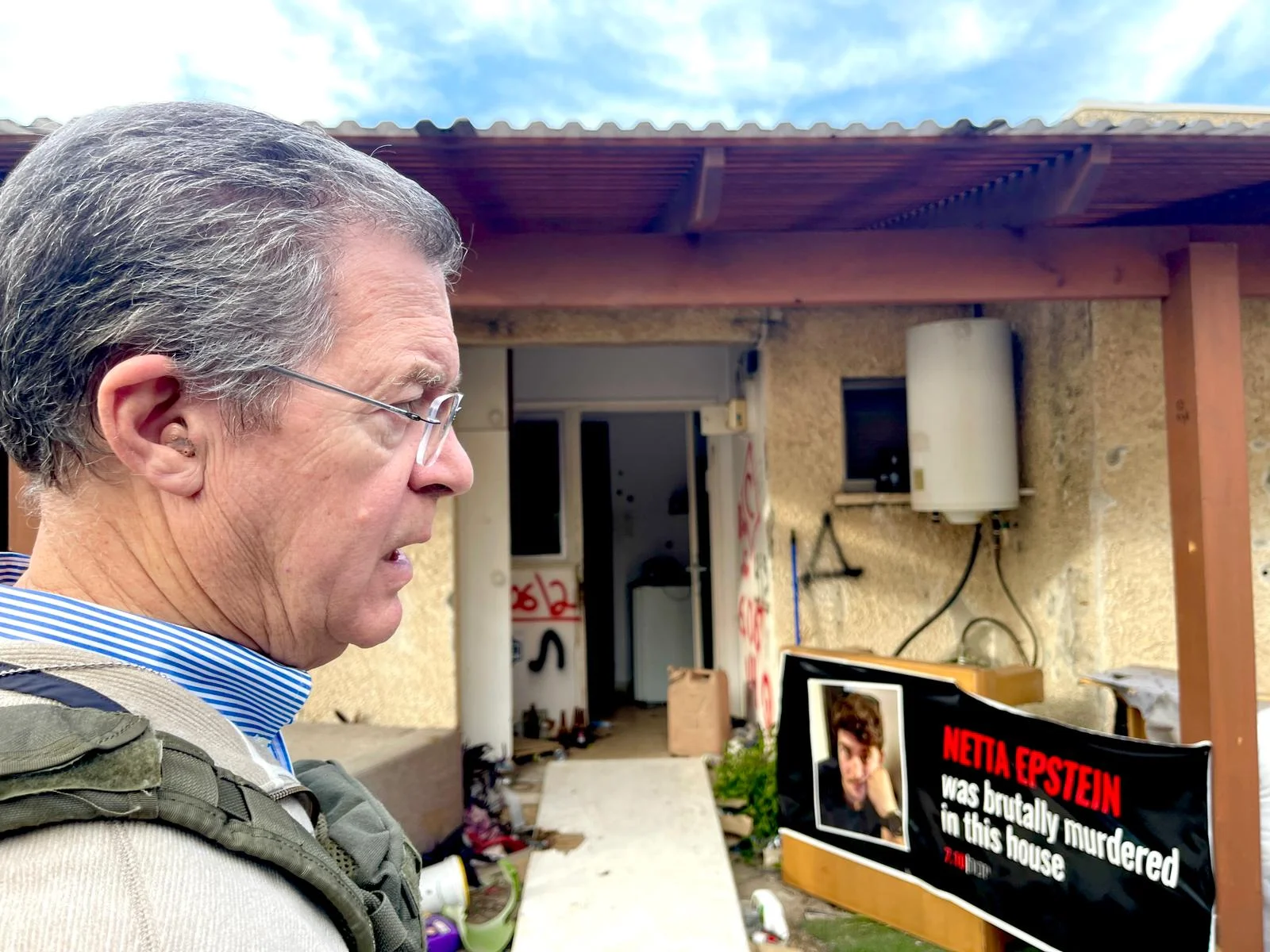Brownback_walking_thru_ruins.jpg
