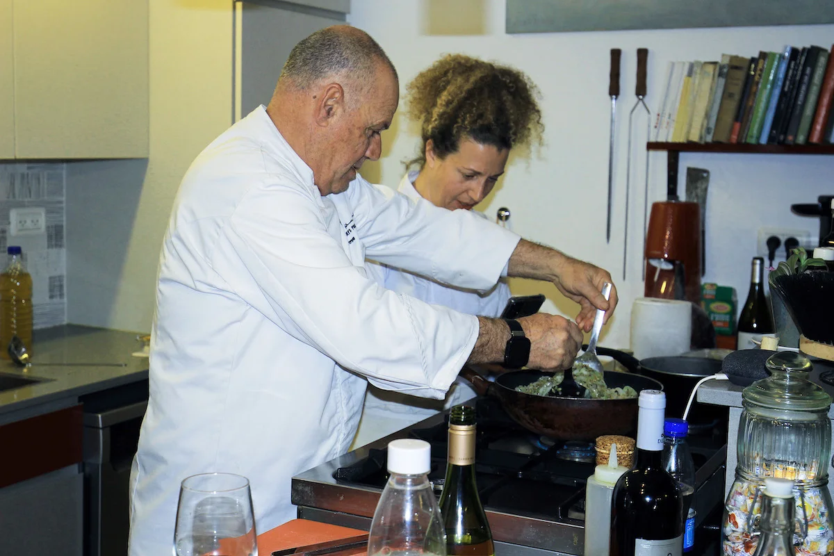 Chefs_Ibrahim_Abuseir_and_Hemdat_Goldberg_helping_each_other_in_the_kitchen_Photo_by_Carrie_Hart.jpg
