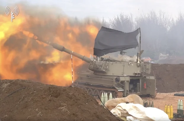 Israeli army carries out massive wave of attacks on Hezbollah positions in southern Lebanon