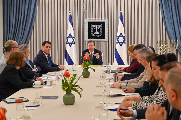 President Isaac Herzog hosts delegations from Likud, Yesh Atid and National Unity for judicial negotiations at his residence in Jerusalem, March 28, 2023. (Kobi Gideon/GPO)