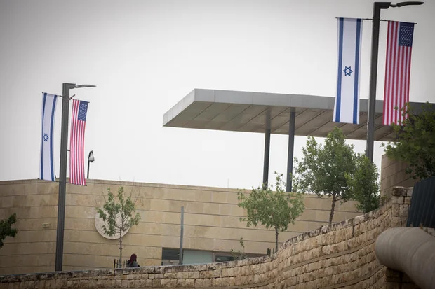 Jerusalem municipality worker hangs an American and Israeli flags near the US consulate in Jerusalem on May 7, 2018. Photo by Yonatan Sindel/Flash90