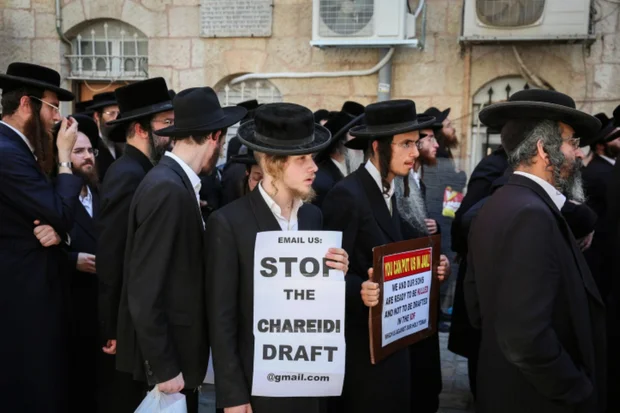 Ultra-Orthodox Jewish men march in protest of the Israeli army mandatory draft. August 13, 2019 (Photo by Flash90).