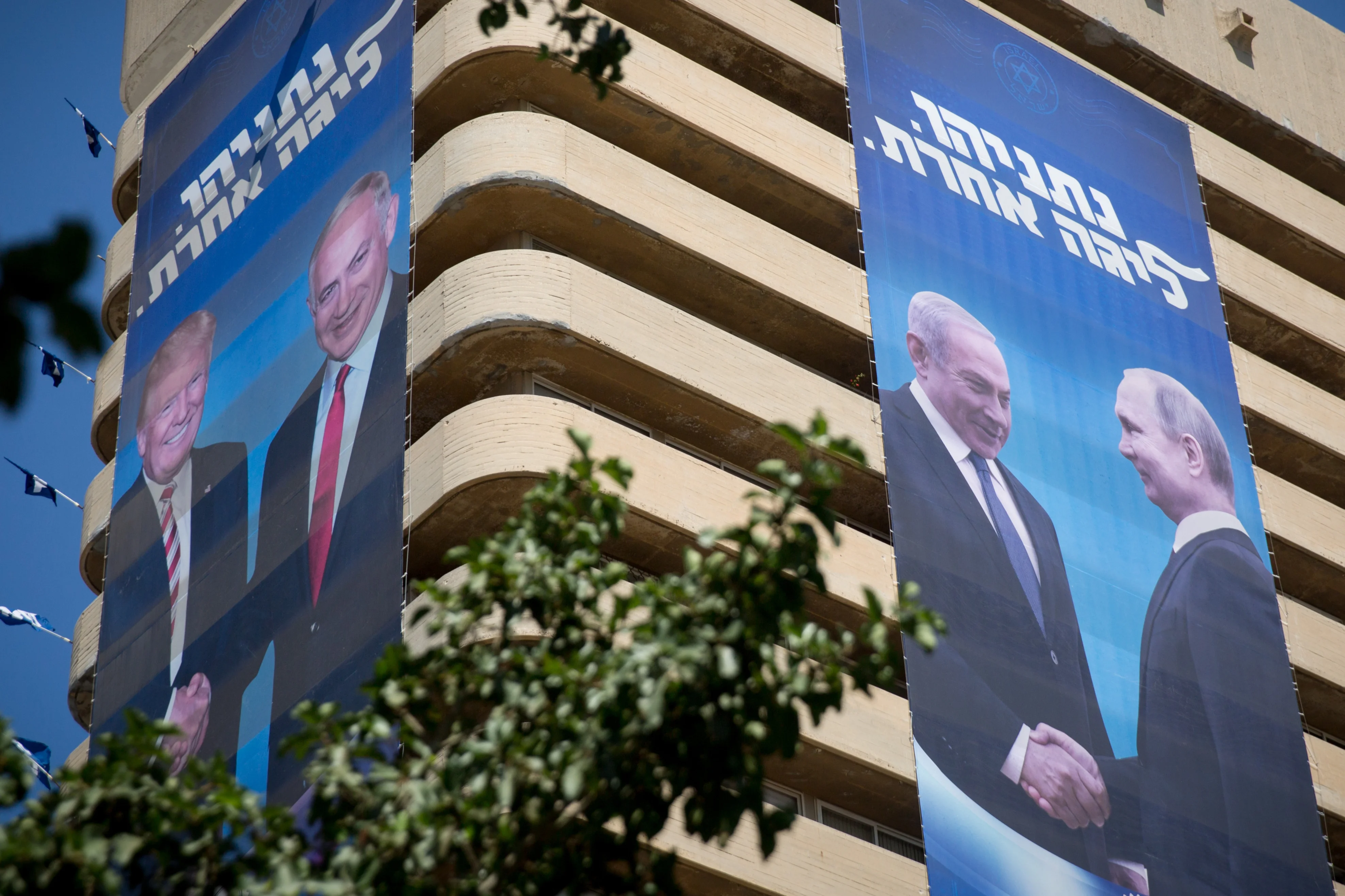 Large billboard depicting US president Donald Trump and Russian presiednt Putin each together with Israeli prime minister Benjamin Netanyahu, as part of the Likud election campaign, in seen at the Likud headquarters in Tel Aviv on September 4, 2019. Photo by Miriam Alster/Flash90