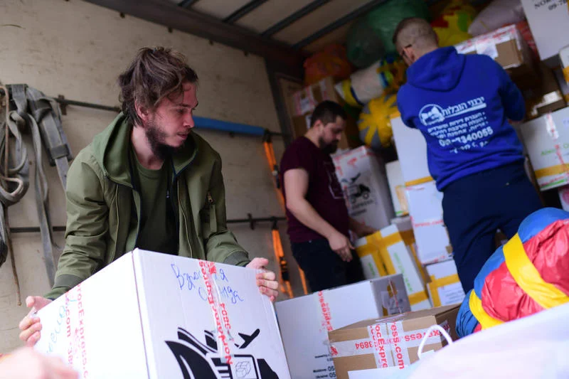 Volunteers pack food and clothes of Israeli humanitarian aid destined for Ukraine, in Tel Aviv, on March 03, 2022. Photo by Tomer Neuberg/Flash90