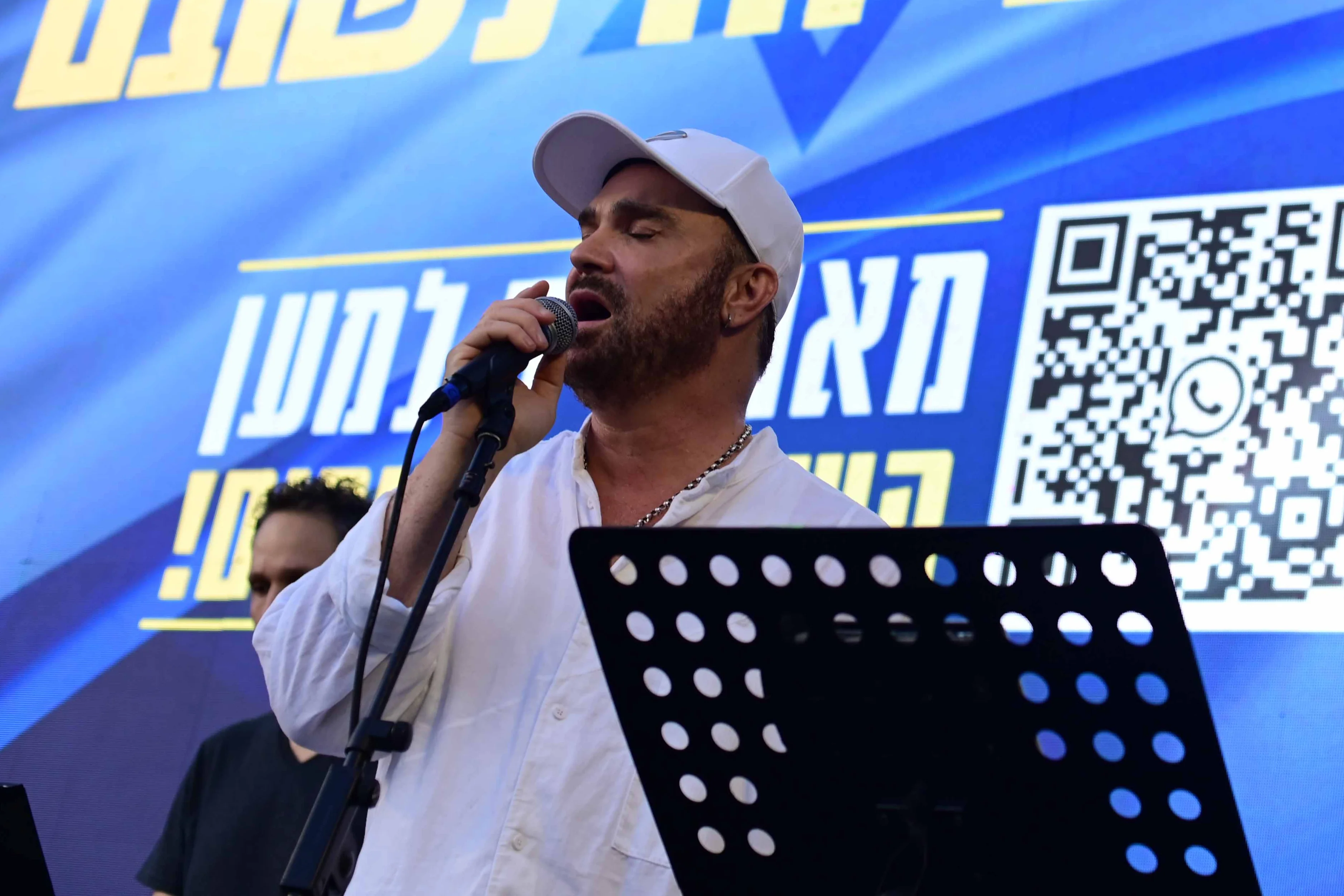 Israeli singer David D'Or sing during a rally calling for the release of Israelis held hostage by Hamas terrorists in Gaza, at 