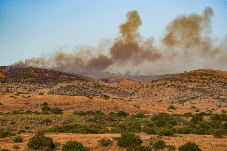 Smoke and fire after rockets fired from Lebanon hit an open area in the Golan Heights, July 3, 2024. (Photo by Ayal Margolin/Flash90)
