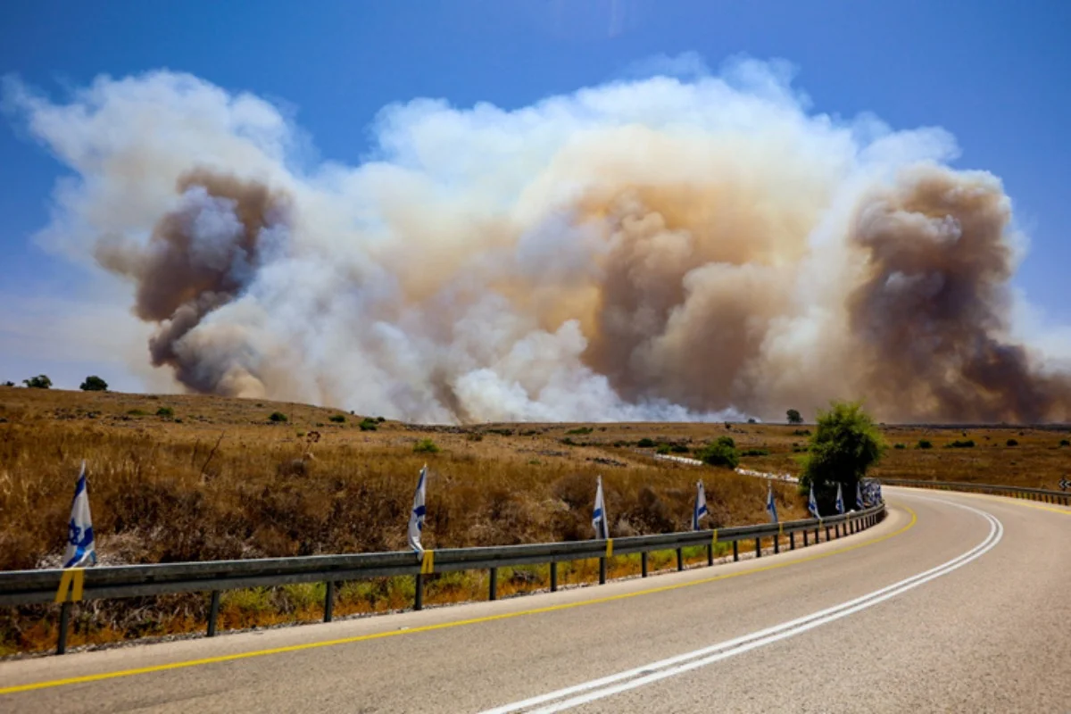 Smoke and fire after rockets and drones fired from Lebanon hit open areas in the Golan Heights, July 4, 2024 (Photo: Maor Kinsbursky/Flash90).