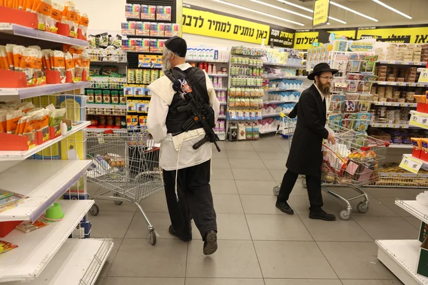 Ultra orthodox jews shop at the Yesh Chesed Supermarket in the northern Israeli city of Tzfat, August 1, 2024. Photo by David Cohen/Flash90
