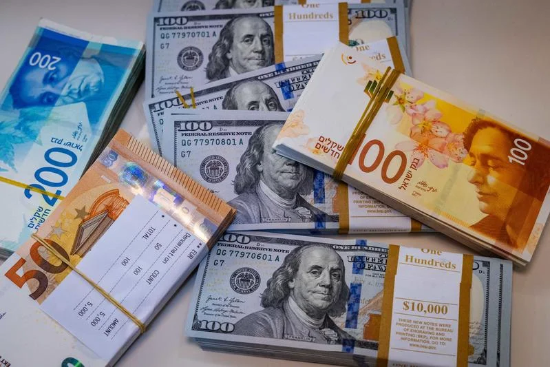 Illustration of American 100 dollar bills, 100 shekel bills and 50 euro bills, in Jerusalem, May 19, 2025. Photo by Nati Shohat/Flash90