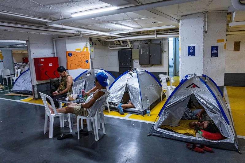 People take shelter in an underground parking lot in Tel Aviv, during ongoing missile attacks from Iran, June 24, 2025. Photo by Yonatan Sindel/Flash90