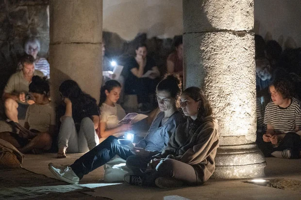 Secular and religious Jews attend the reading of the Book of Lamentations (Eicha) on the eve of Tisha B’Av at the Ancient synagogue in Katsrin, Golan Heights, August 2, 2025. Photo by Michael Giladi/Flash90