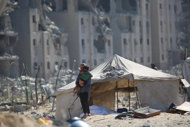 Displaced Palestinians seen near their tents at the Nuseirat camp in the central Gaza Strip, September 13, 2025. Photo by Ali Hassan/Flash90