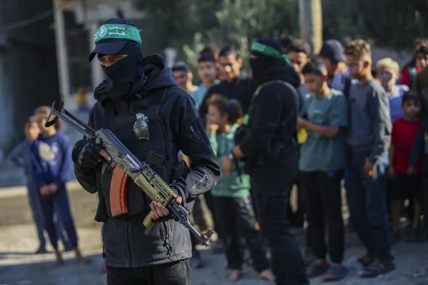 Members of the Qassam Brigades use heavy machinery to search for the bodies of Israeli hostages in the Nuseirat refugee camp in the central Gaza Strip, October 28, 2025. Photo by Ali Hassan/Flash90