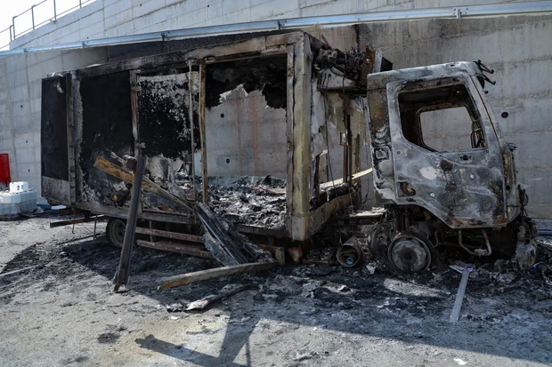 Palestinians inspect burned trucks and cars following an attack by Israeli settlers in the village of Beit Lid, east of Tulkarm, in the West Bank, on November 12, 2025. Photo by Nasser Ishtayeh/Flash90