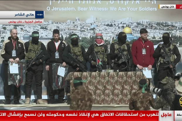 Hostages no more: Trupanov, Horn & Dekel-Chen cross into Israel | Hamas forces three hostages to give speeches on stage before release