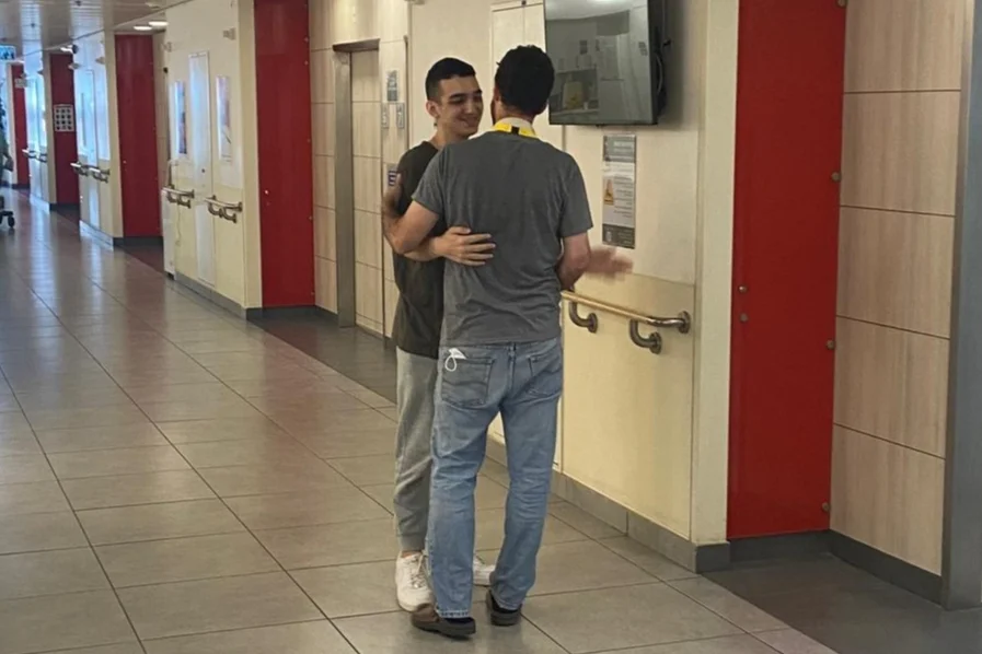 Sagui Dekel-Chen, freed after 498 days in captivity, visits fellow Israeli-American hostage survivor Edan Alexander in hospital. (Photo: Bring Them Home / X)