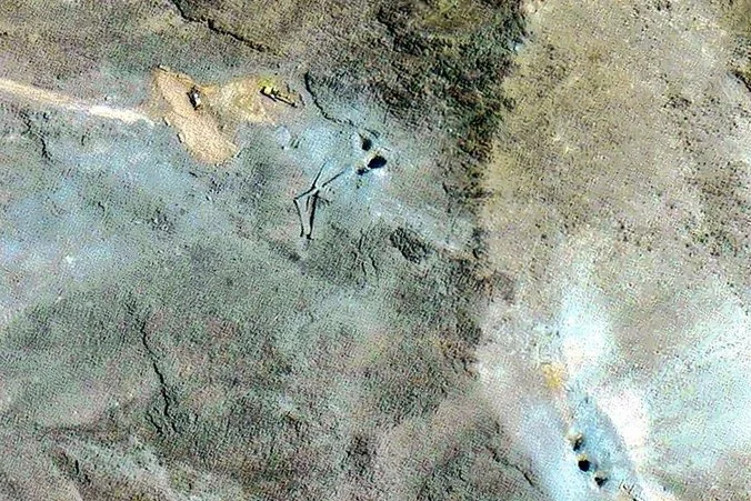Iranian excavation efforts near the impact craters around the entrances to the Fordow Uranium Enrichment Plant. June 28, 2025. (Photo used under section 27A of the copyright law).