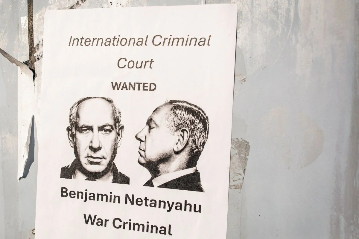 Washington, D.C. US - December 27, 2024: a poster accusing Benjamin Netanyahu to be a war criminal wanted by International Criminal Court with his mugshot in the center. Photo: Shutterstock.