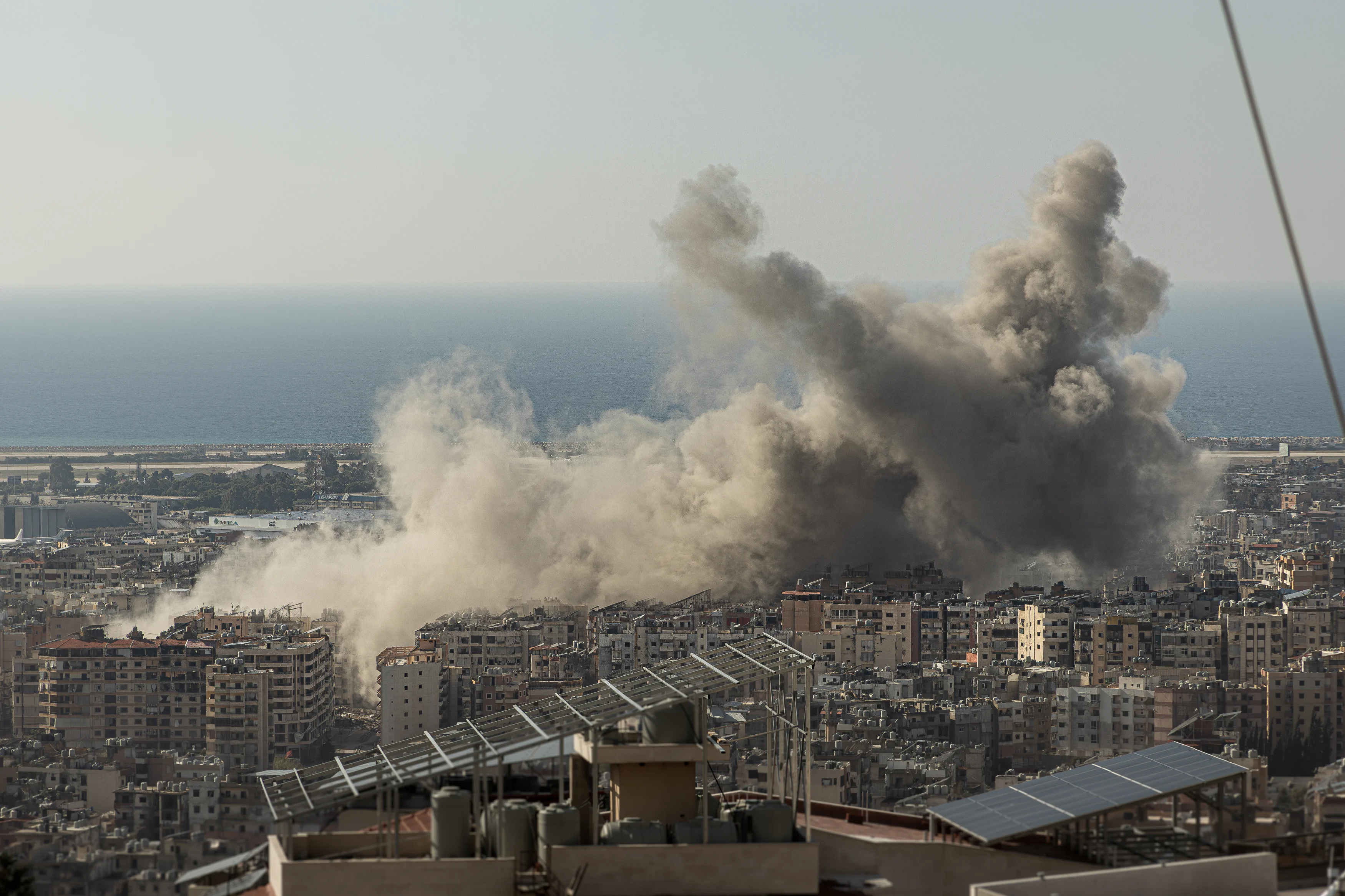 Dust rises above Beirut's Dahiyeh suburb after multiple Israeli airstrikes destroyed apartment buildings on Nov. 12, 2024. Photo by Collin Mayfield/Sipa USA via Reuters Connect