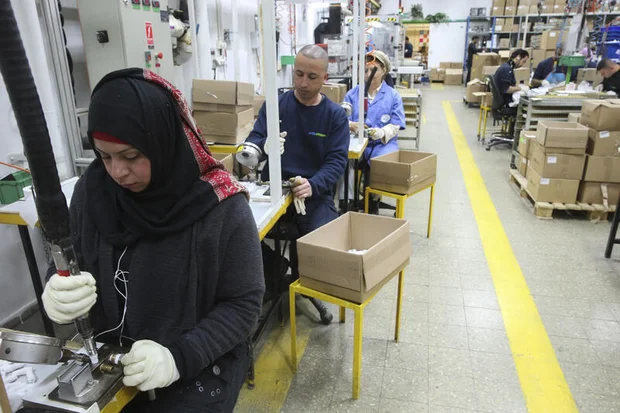 Palestinians and Jews work at a SodaStream factory in the Mishor Adumim industrial park, next to the Maale Adumim. February 2, 2014 Photo by Nati Shohat/Flash90
