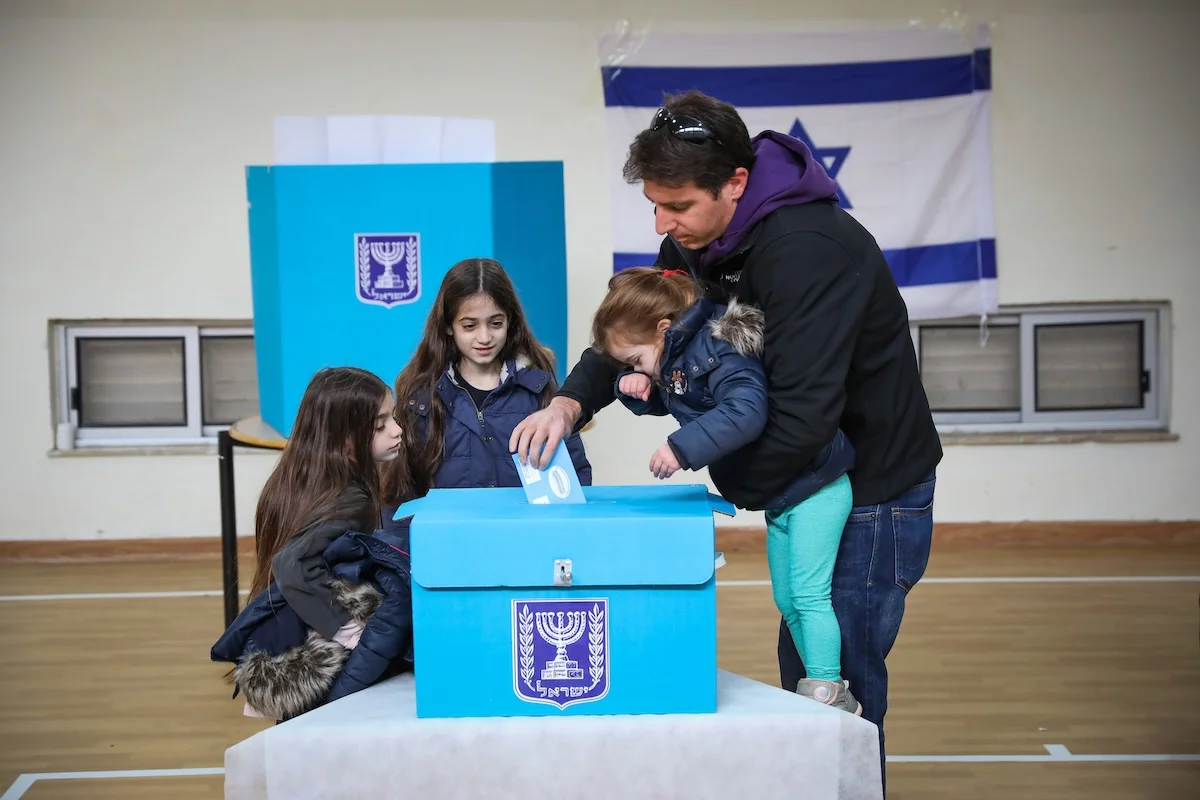 People cast their ballot at a voting station in Jerusalem