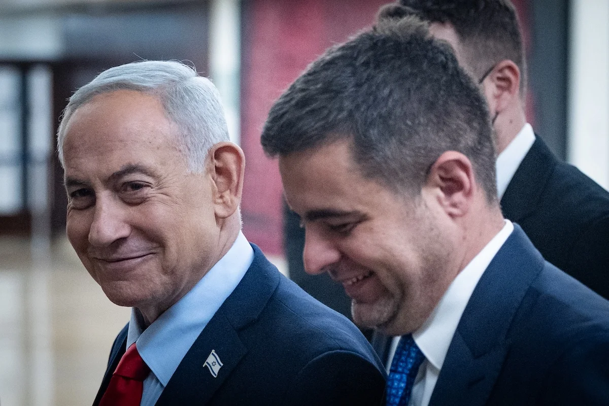 Israeli Prime Minister Benjamin Netanyahu walks outside his office