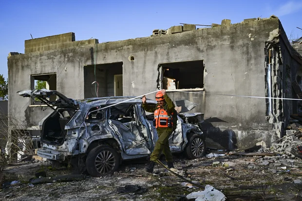 People look at the damage after a missile fired toward Israel overnight struck Zarzir, in northern Israel, March 13, 2026. Photo by Michael Giladi/Flash90