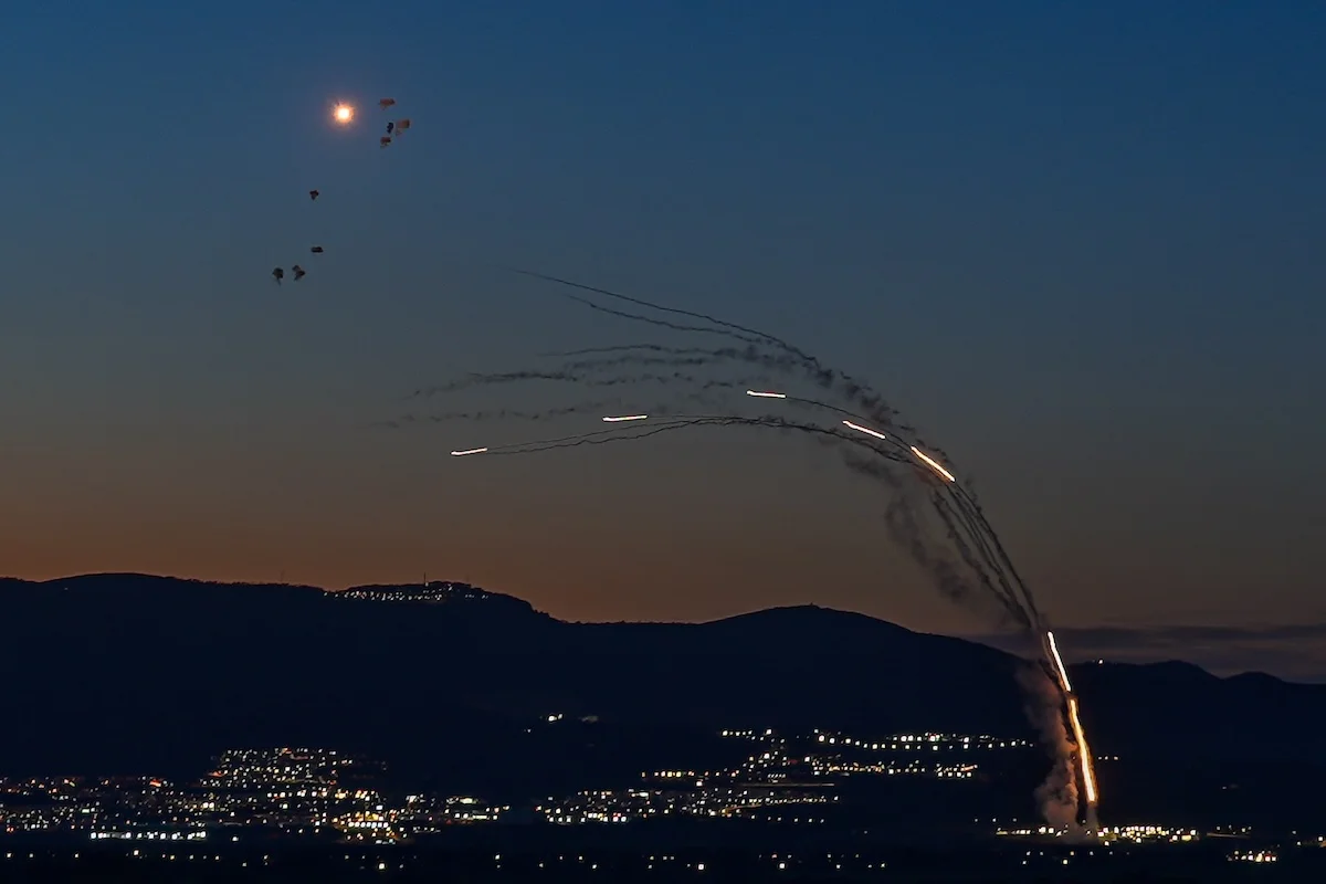 Anti-missile batteries fire interception missiles toward incoming ballistic missiles launched from Lebanon
