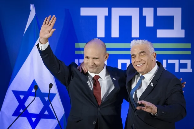 Opposition Leader and Head of the Yesh Atid party Yair Lapid and former Prime Minister Naftali Bennett speak during a press conference announcing a joint list named “Together” ahead of upcoming elections, to be led by Bennett, in Herzliya, central Israel, April 26, 2026. (Photo: Chaim Goldberg/Flash90)
