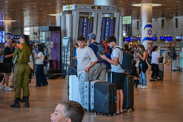 Passengers at Ben Gurion Airport near Tel Aviv during the Iranian missile fire toward Israel, June 8, 2026. Photo by Avshalom Sassoni/Flash90
