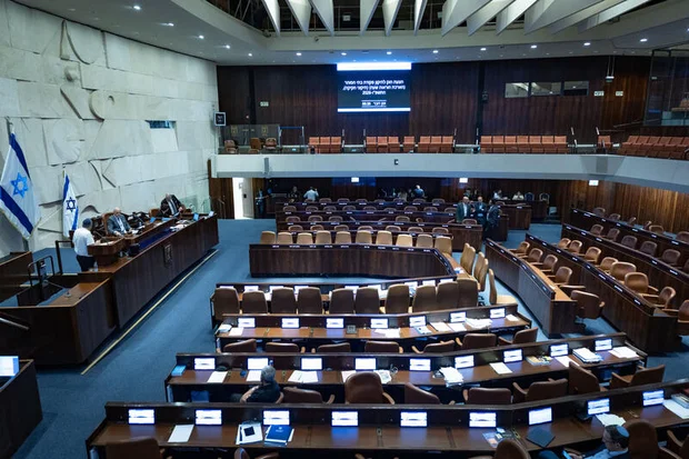 Members of the Knesset attend a plenum session in the assembly hall of the Israeli parliament in Jerusalem, July 28, 2026. Photo by Yonatan Sindel/Flash90