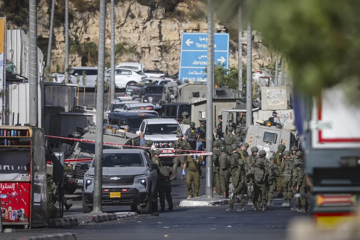 Israeli security forces near the scene of a shooting attack near Hebron